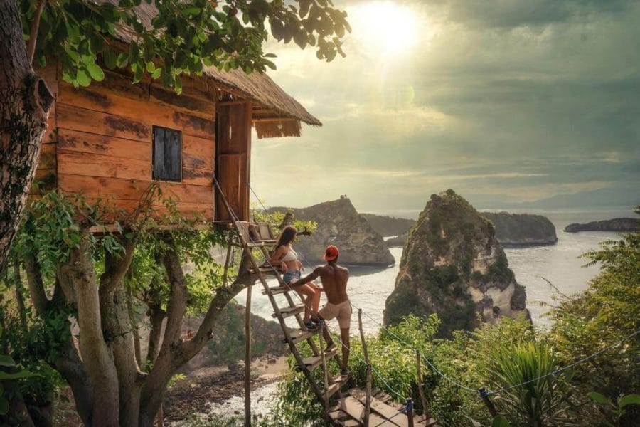 Romantic couple looking at ocean and islands from Nusa Penida Tree House – Fun Trev East Tour Package B